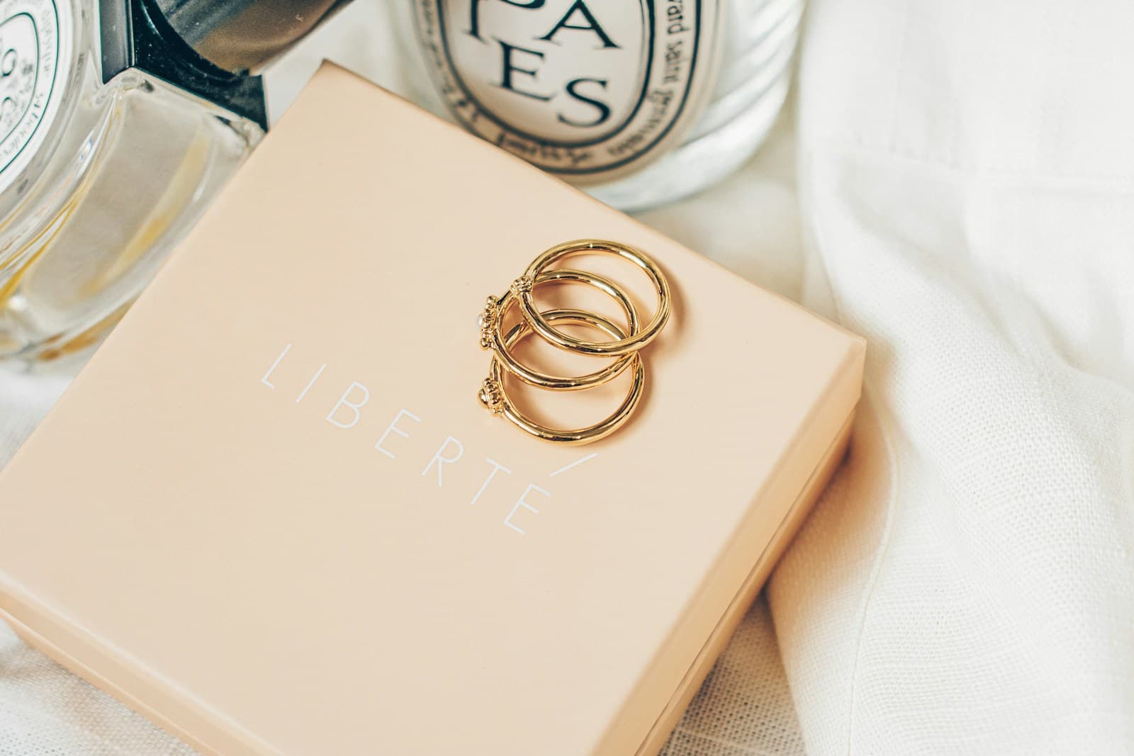 Gold stacking rings arranged on a book.
